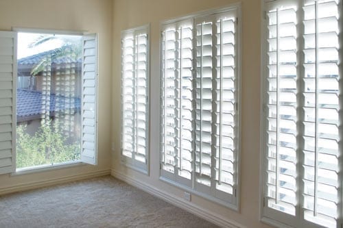 Window blinds in white room