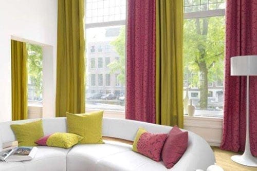 Living room with Pink and yellow drapes