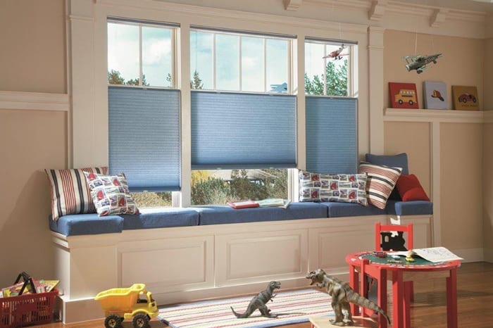 kids room with blue roll up blinds